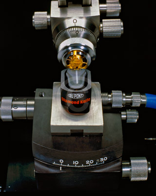 HD_SL-02 - Product photo of DuPont Diamond Knife in the process of slicing samples thinner than a human hair for examination in either a optical or electron microscope.