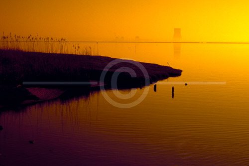 HD_SL-28 - Sunrise photo taken from across the Delaware River below New Castle, DE of the Salem Nuclear Power Station through the early morning mist. HD_SL-28 - Sunrise photo taken from across the Delaware River below New Castle, DE of the Salem Nuclear Power Station through the early morning mist.