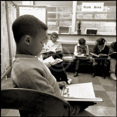 HD_P-07 - Child reading during school day reading hour at Catholic school in Wilmington, Delaware HD_P-07 - Child reading during school day reading hour at Catholic school in Wilmington, Delaware