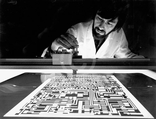 HD_P-13 - Tech at Lockheed Electric preparing master negative for printed circuit board.