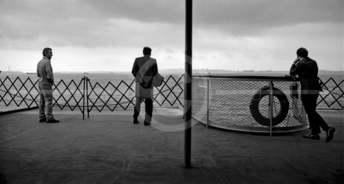 HD_P-33 - Three passenger at stern of Staten Island Ferry in New York Harbor. HD_P-33 - Three passenger at stern of Staten Island Ferry in New York Harbor.