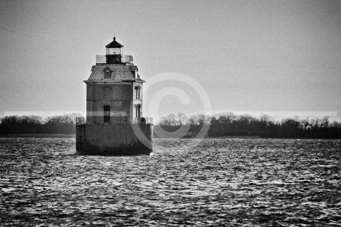 HD_STBW-18 - Sandy Point Shoal Lighthouse as seen at sunrise from the beach at Sandy Point State Park in Maryland. Lighthouse sits in 5 ft of water about 1,000 ft from shore, just north of the Chesapeake Bay Bridge. It was built in 1883.