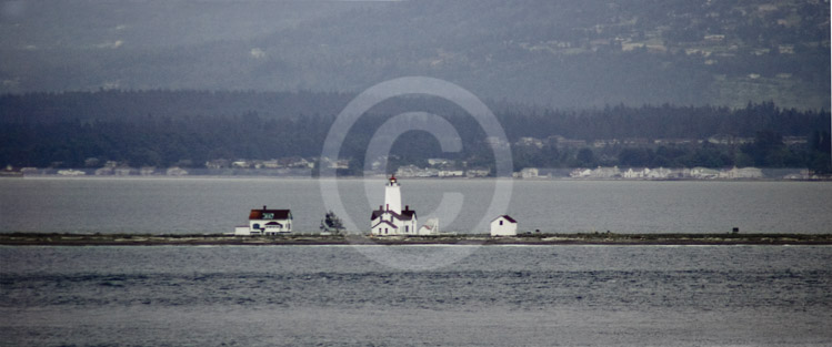 HD_STC-27 - New Dungeness Light Station as seen from the deck of the SS Oosterdam as we left Seattle. Located on a spit of land sticking out into the Strait of Juan de Fuca. HD_STC-27 - New Dungeness Light Station as seen from the deck of the SS Oosterdam as we left Seattle. Located on a spit of land sticking out into the Strait of Juan de Fuca.